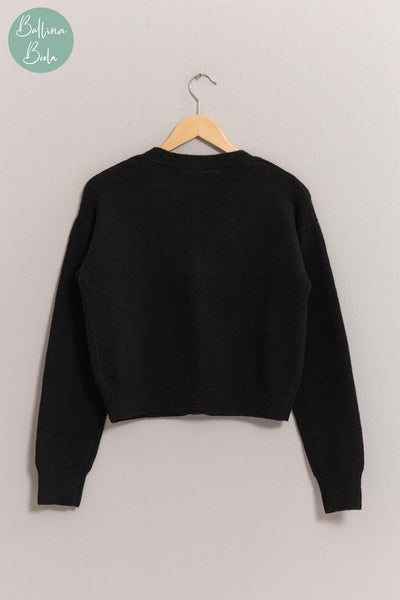 Sweater negro con corazones