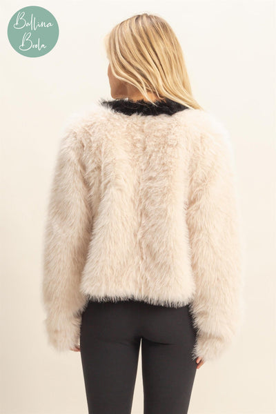 Sweater crema con negro