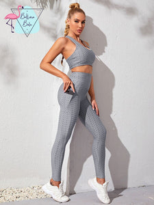 Conjunto deportivo top y leggins gris con bolsas